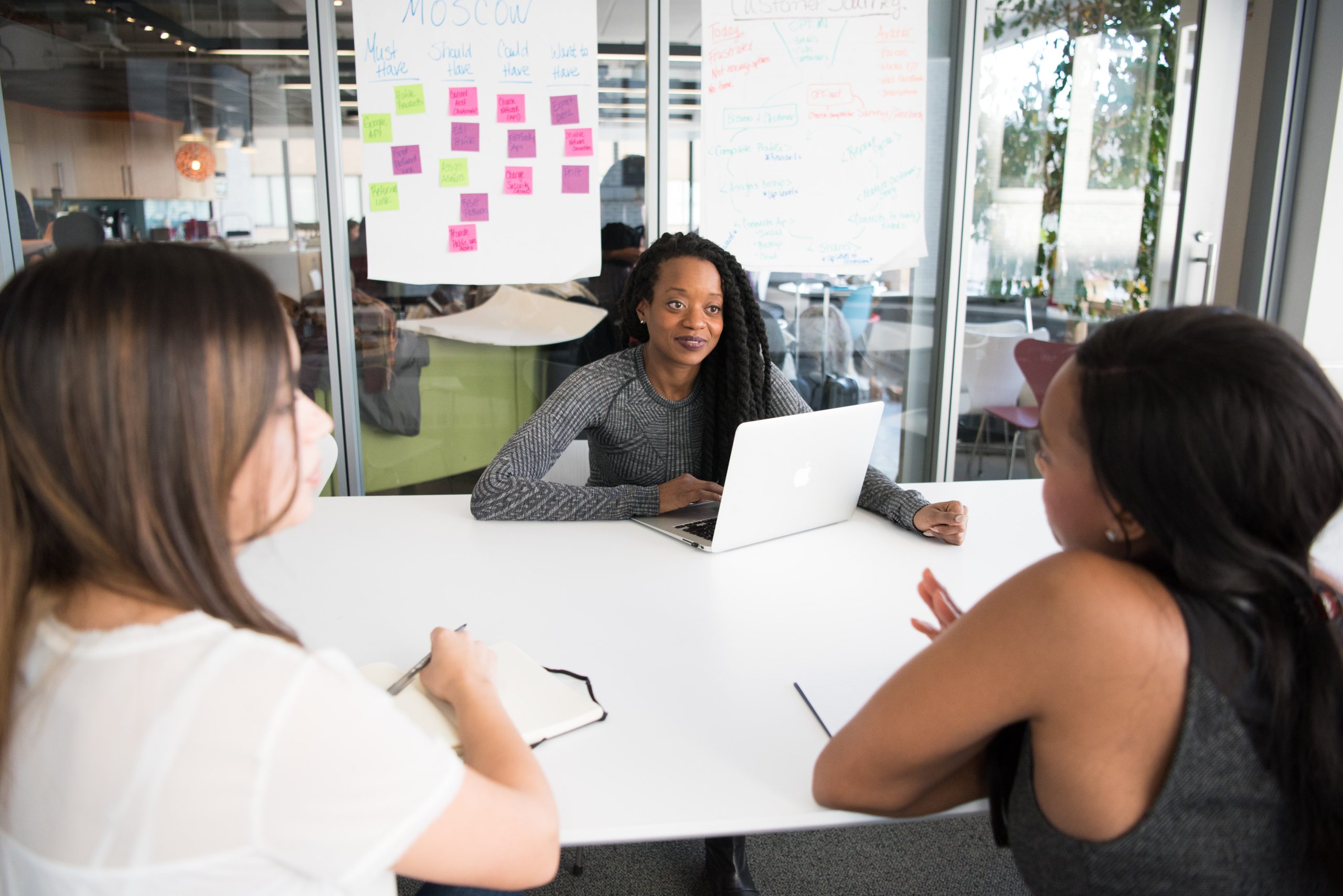 picture of 3 women meeting at table